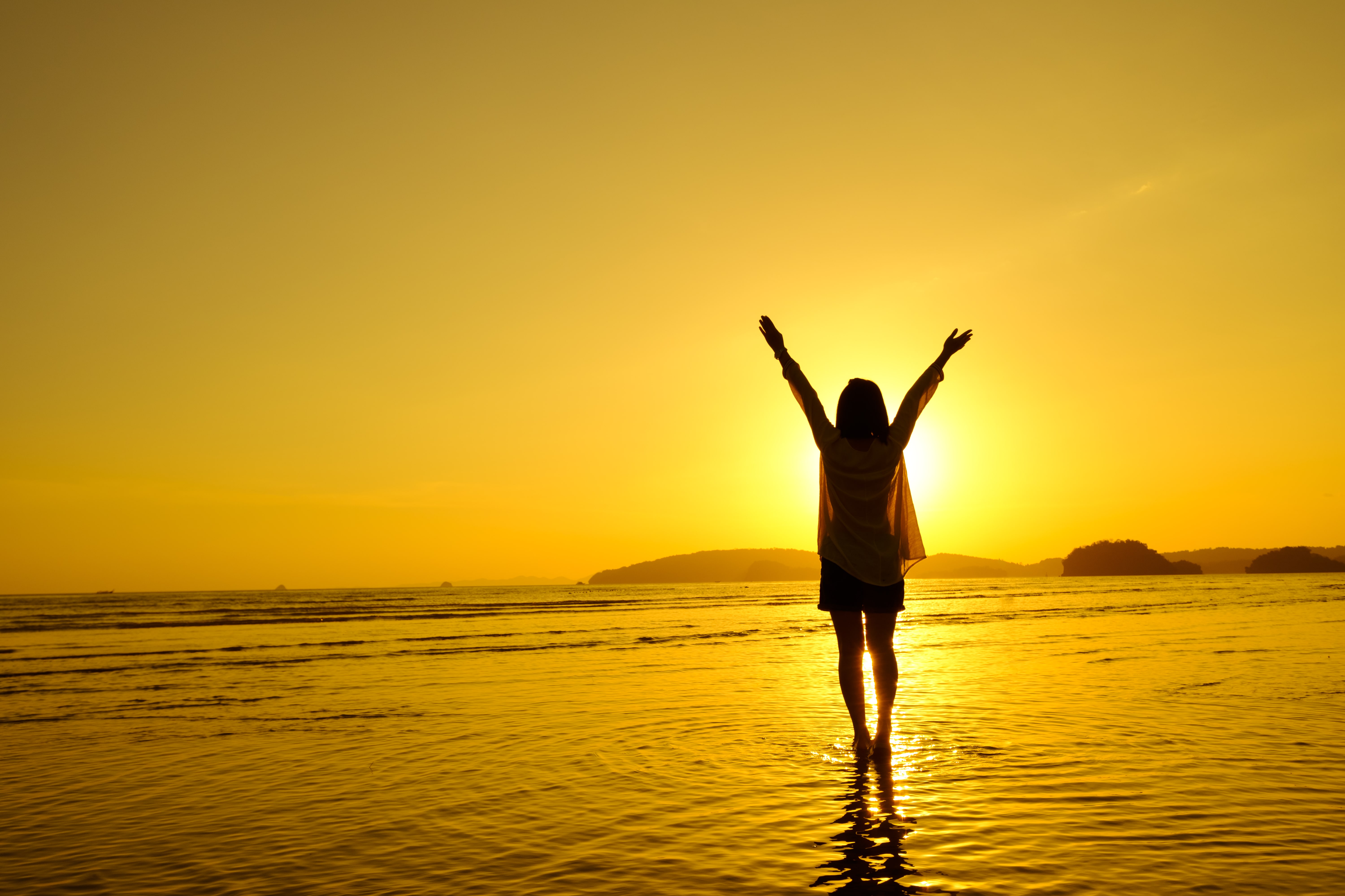 woman jumping at sea beach